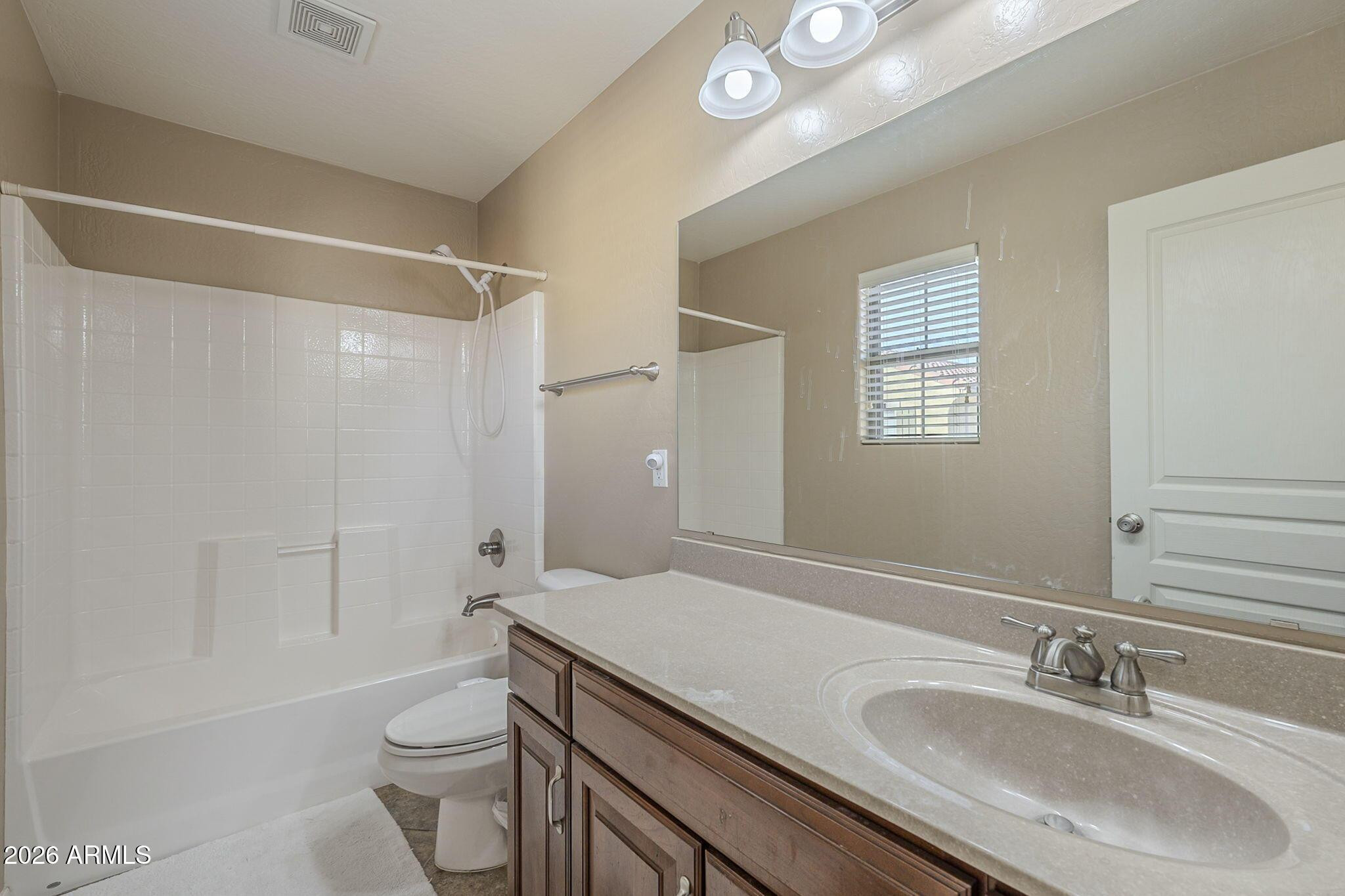 451 South Hawes Road, Unit 45 Mesa, AZ 85208 - Photo 23 of 36 a bathroom with a granite countertop sink toilet and shower