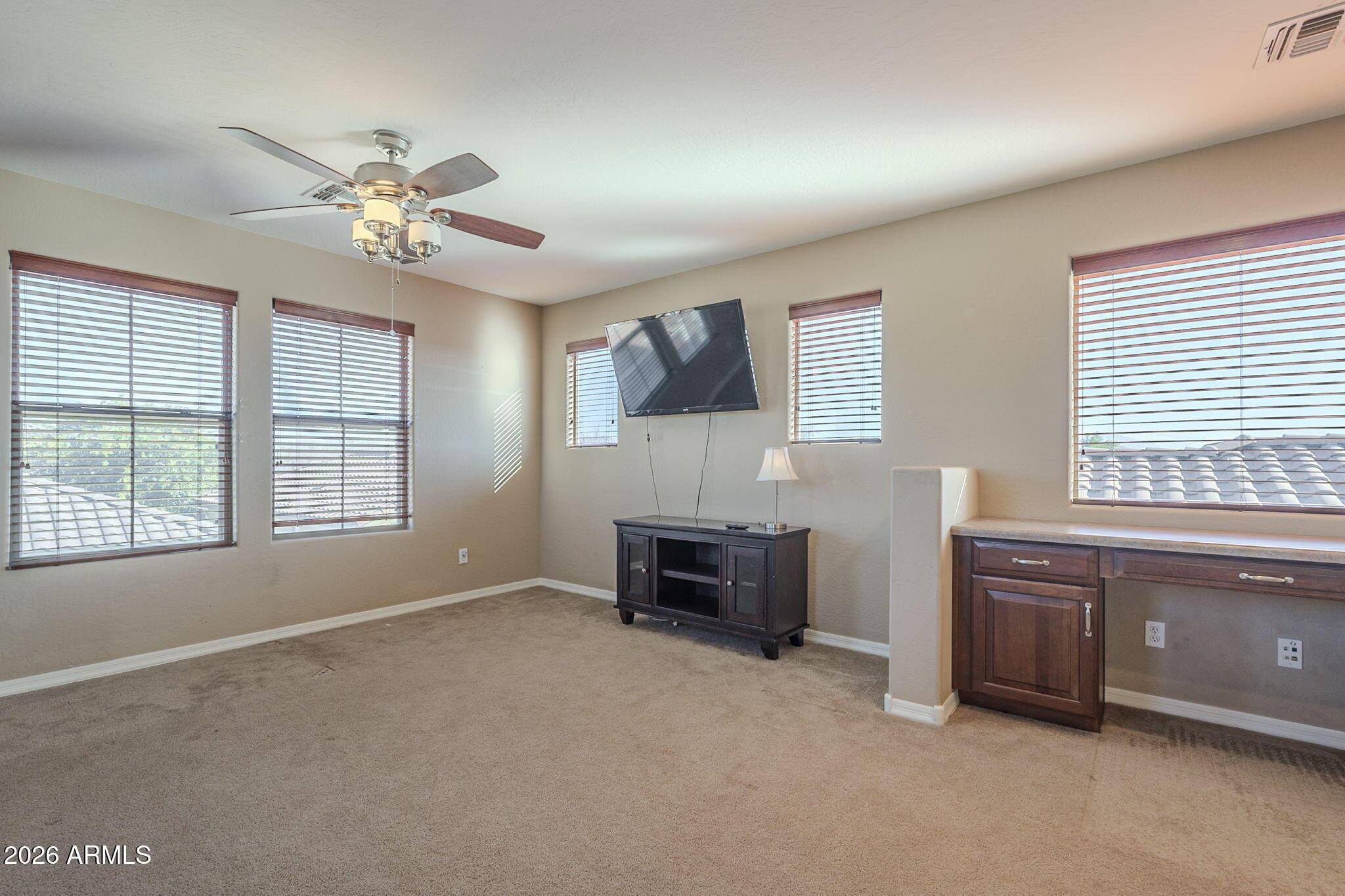 451 South Hawes Road, Unit 45 Mesa, AZ 85208 - Photo 24 of 36 a view of livingroom with furniture ceiling fan and window