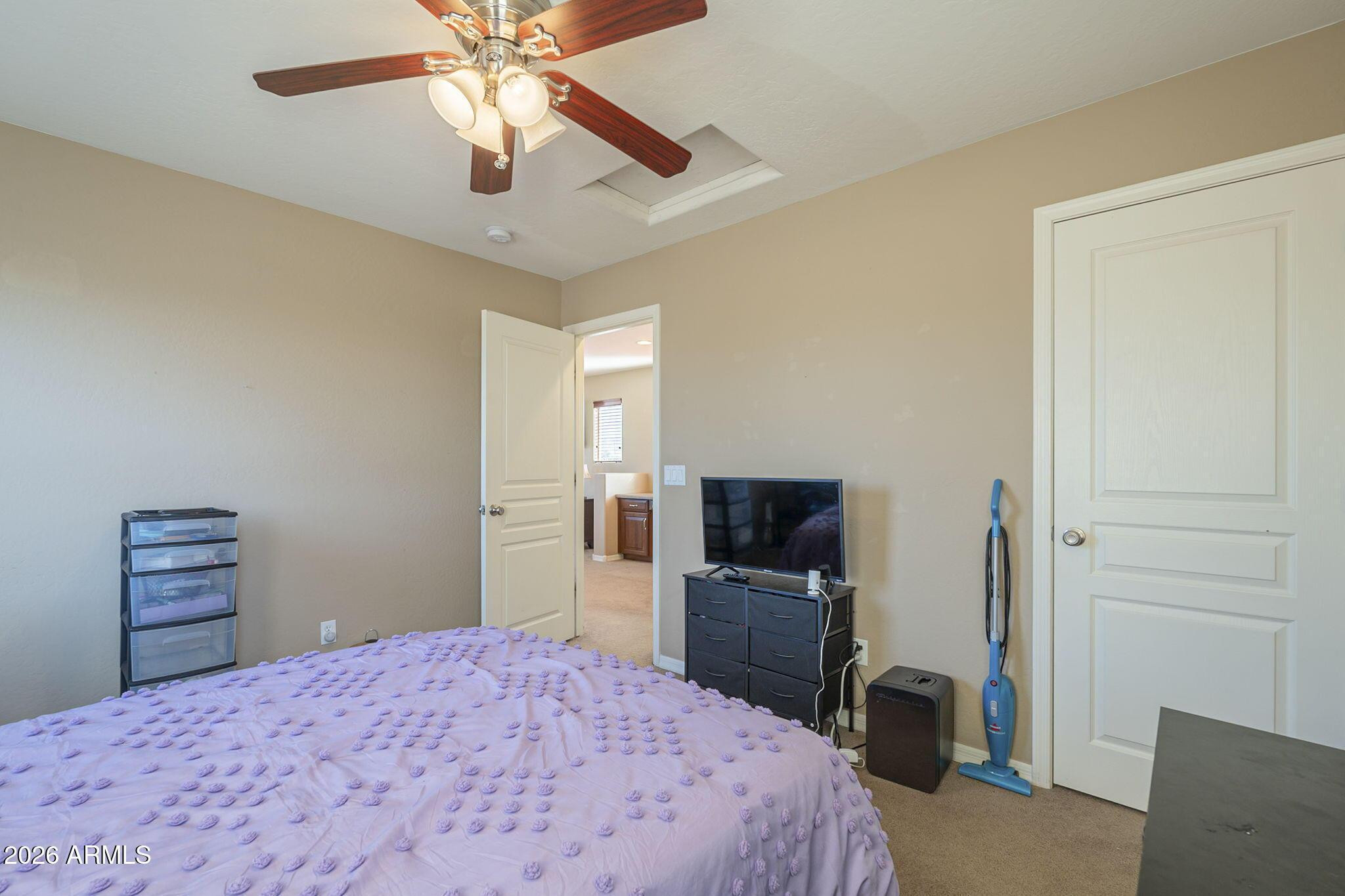 451 South Hawes Road, Unit 45 Mesa, AZ 85208 - Photo 30 of 36 a bedroom with a bed and a television