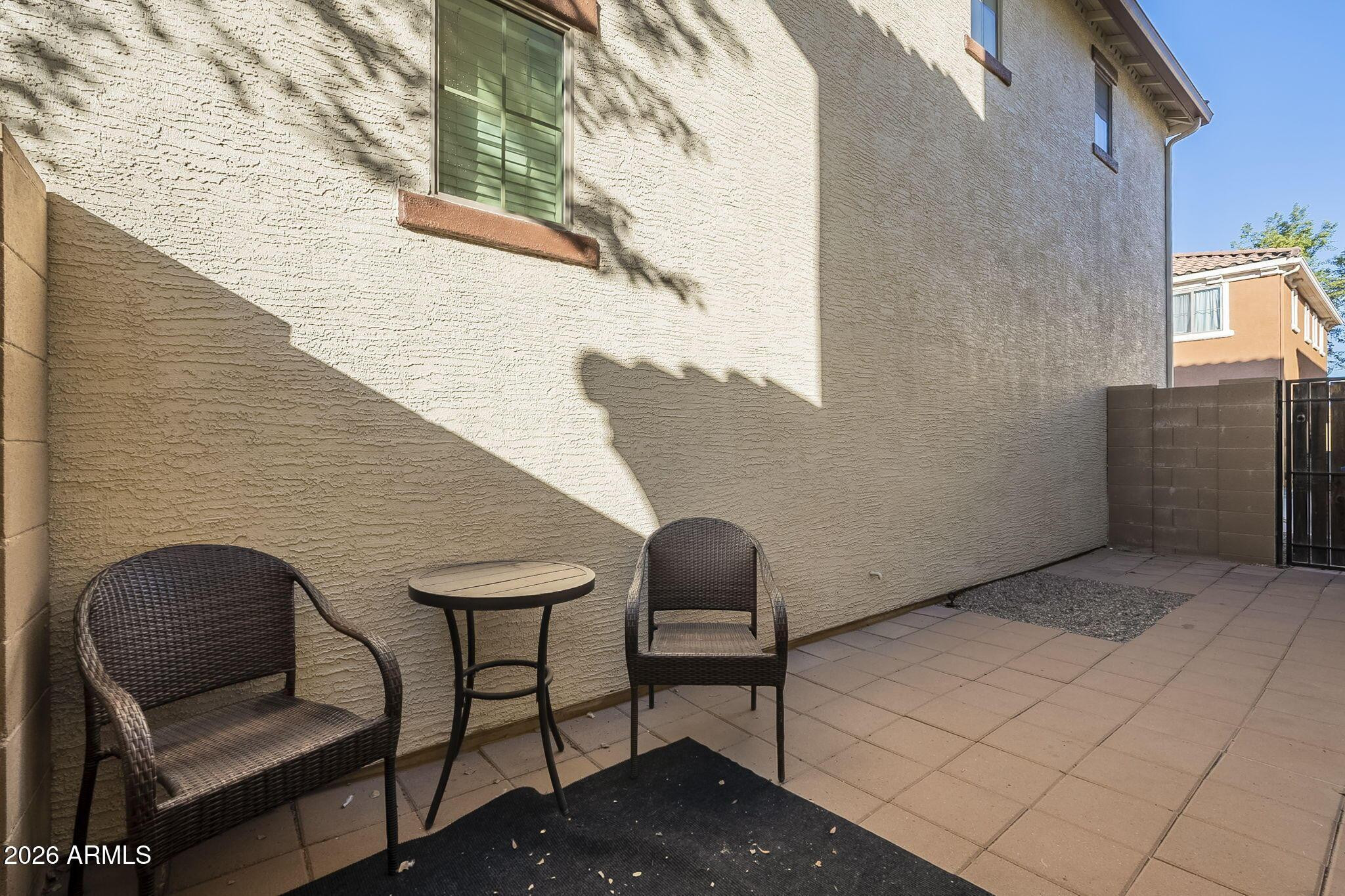 451 South Hawes Road, Unit 45 Mesa, AZ 85208 - Photo 4 of 36 a backyard of a house with table and chairs
