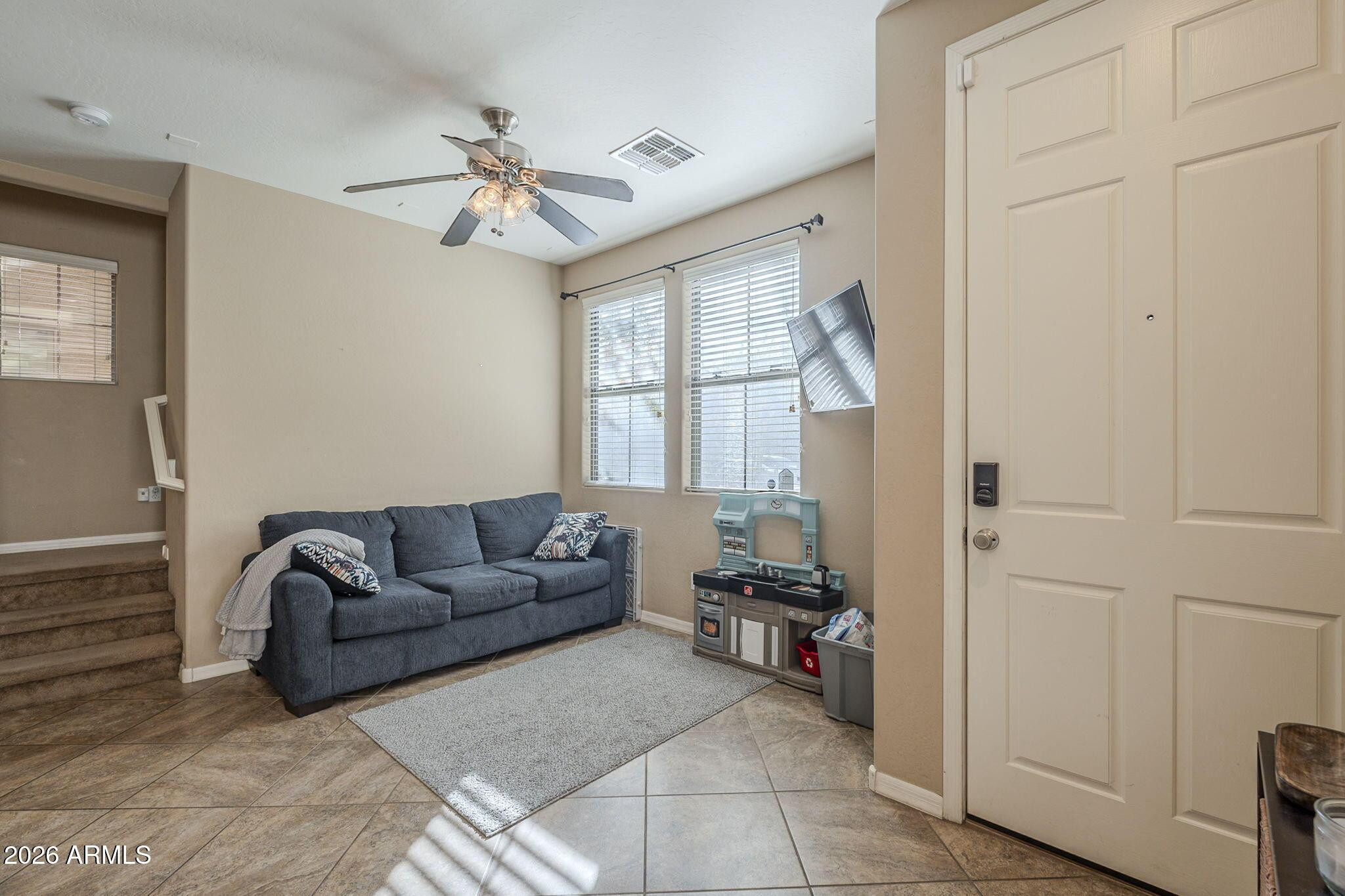 451 South Hawes Road, Unit 45 Mesa, AZ 85208 - Photo 6 of 36 a living room with furniture and a window