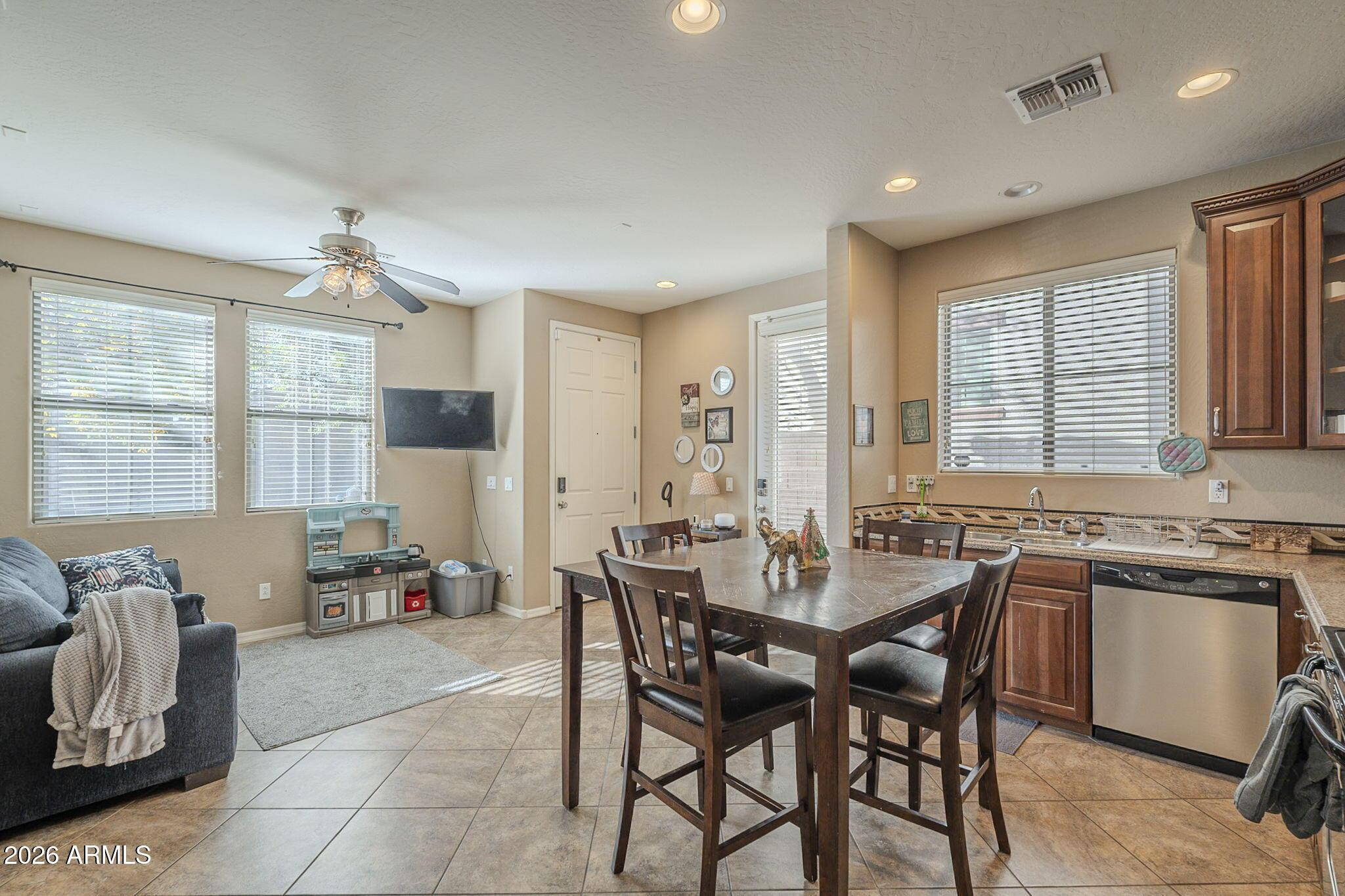 451 South Hawes Road, Unit 45 Mesa, AZ 85208 - Photo 9 of 36 a view of a dining room with furniture window and outside view