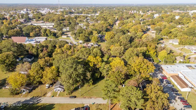 an aerial view of residential building with parking space