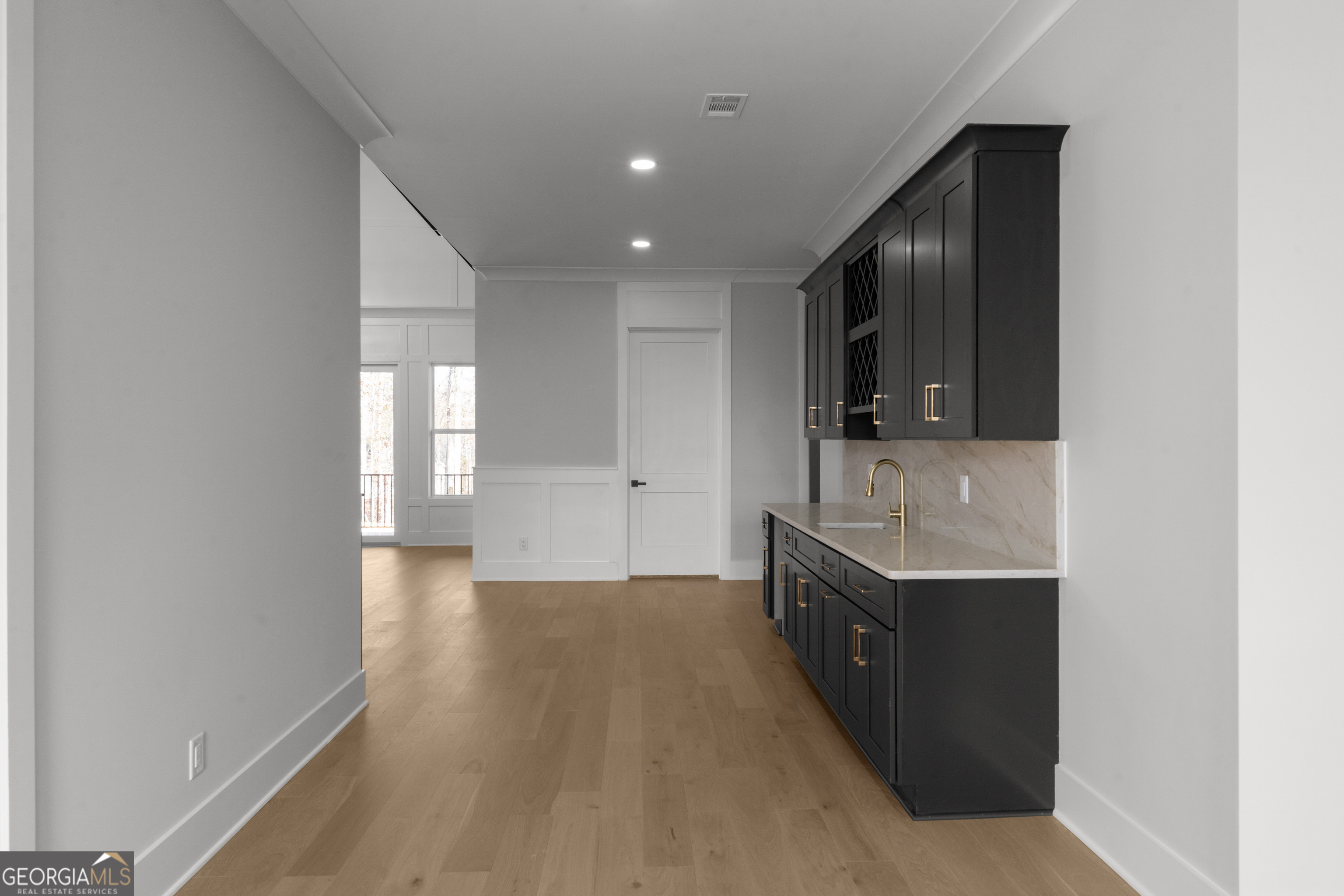 407 Thunder Road Buford, GA 30518 - Photo 106 of 133 a kitchen with granite countertop a sink and a stove top oven