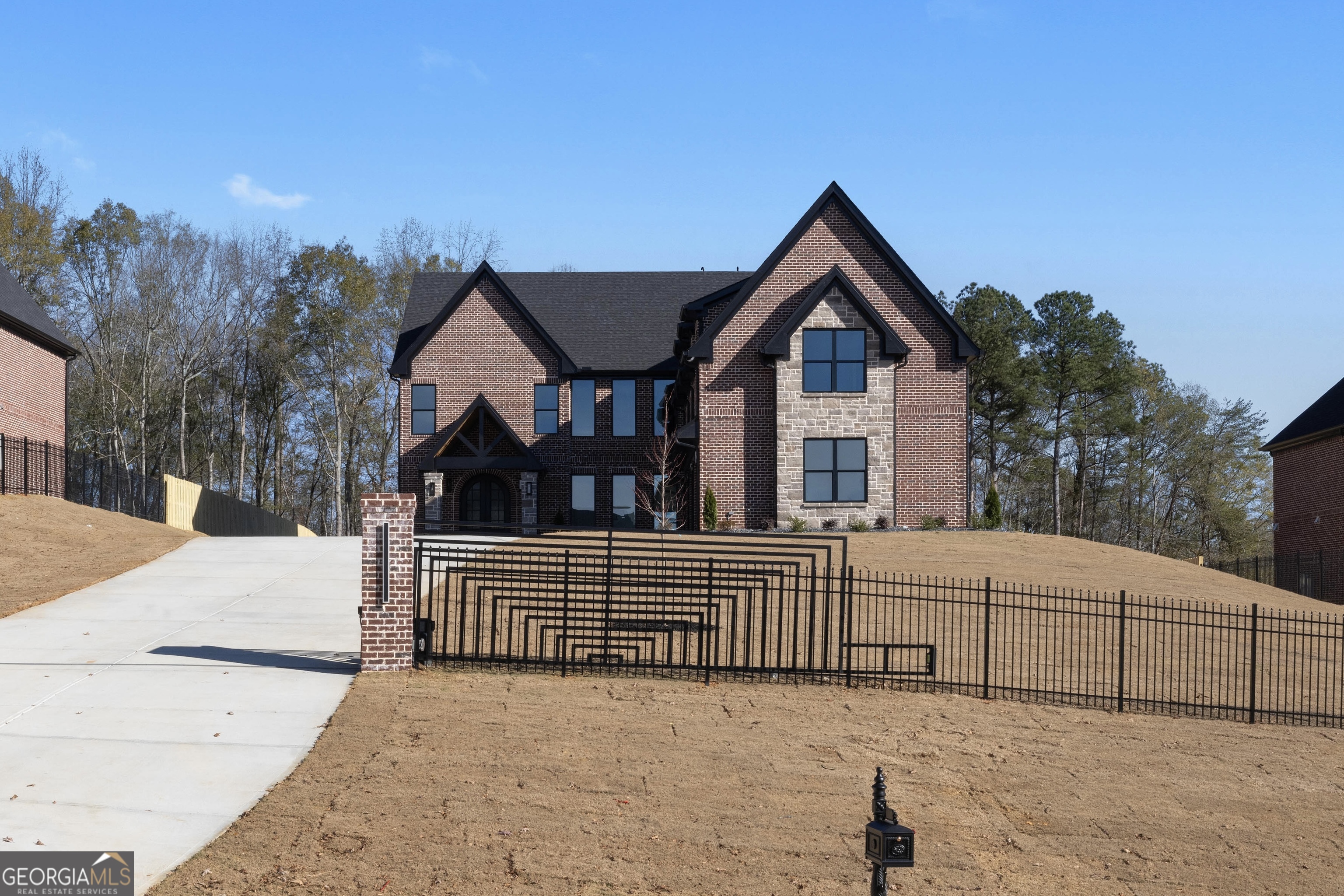 407 Thunder Road Buford, GA 30518 - Photo 120 of 133 a front view of a house with a fence