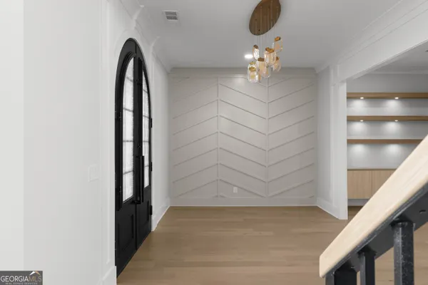 a view of an empty room with a fireplace