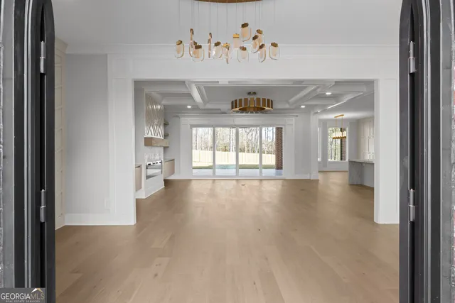 a large kitchen with kitchen island a sink stainless steel appliances and cabinets