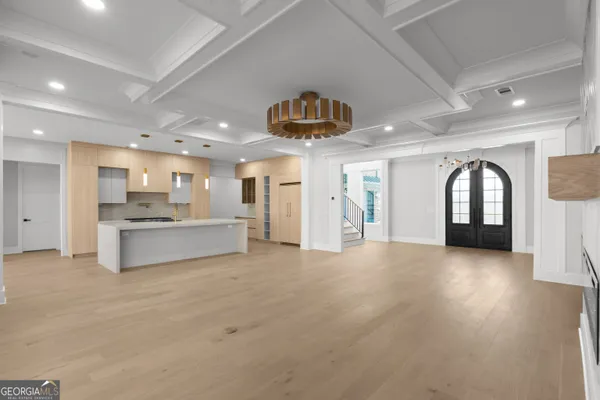 a kitchen with a refrigerator and a stove top oven