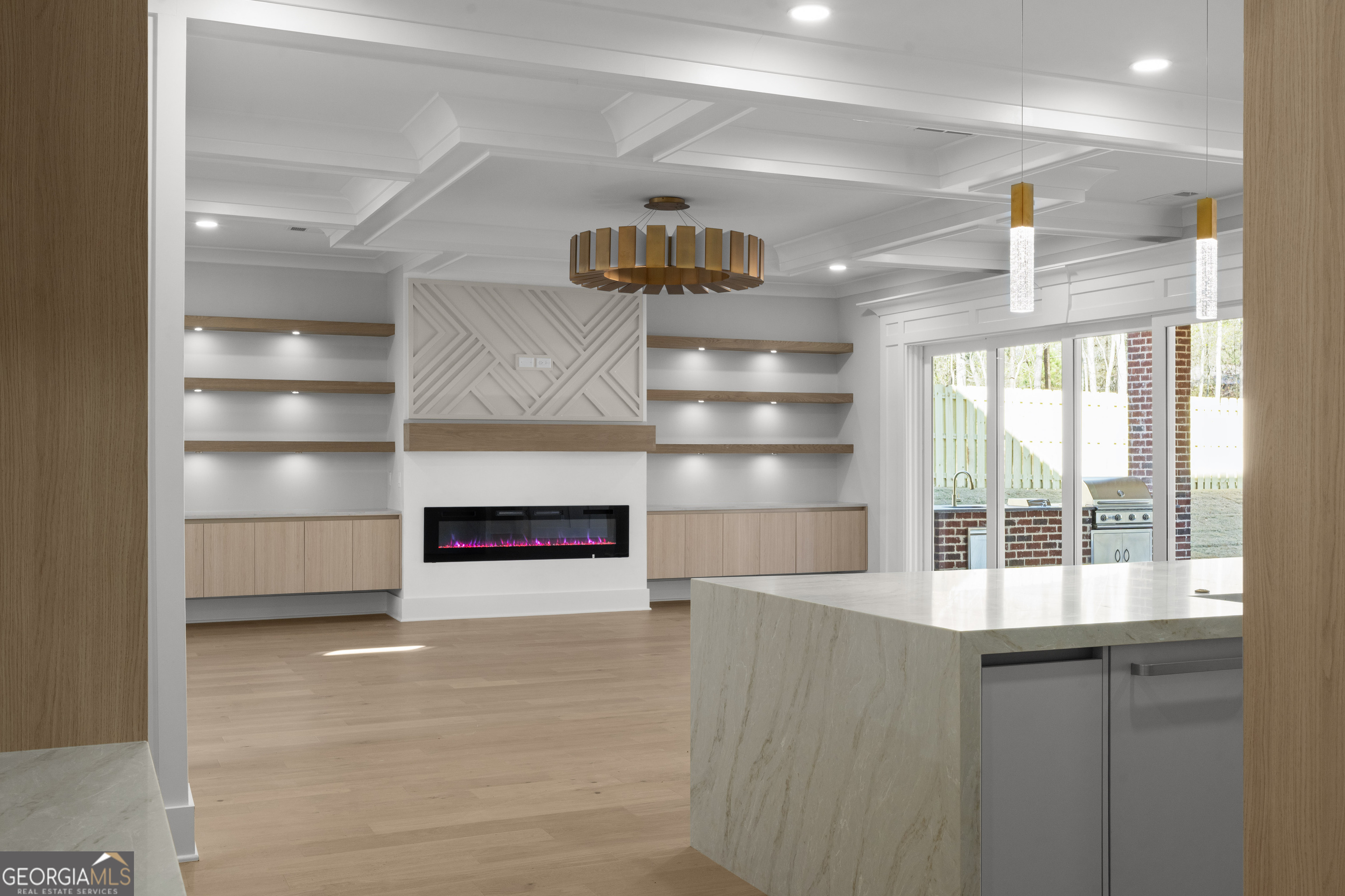 407 Thunder Road Buford, GA 30518 - Photo 22 of 133 a view of a room with shelves and a ceiling fan