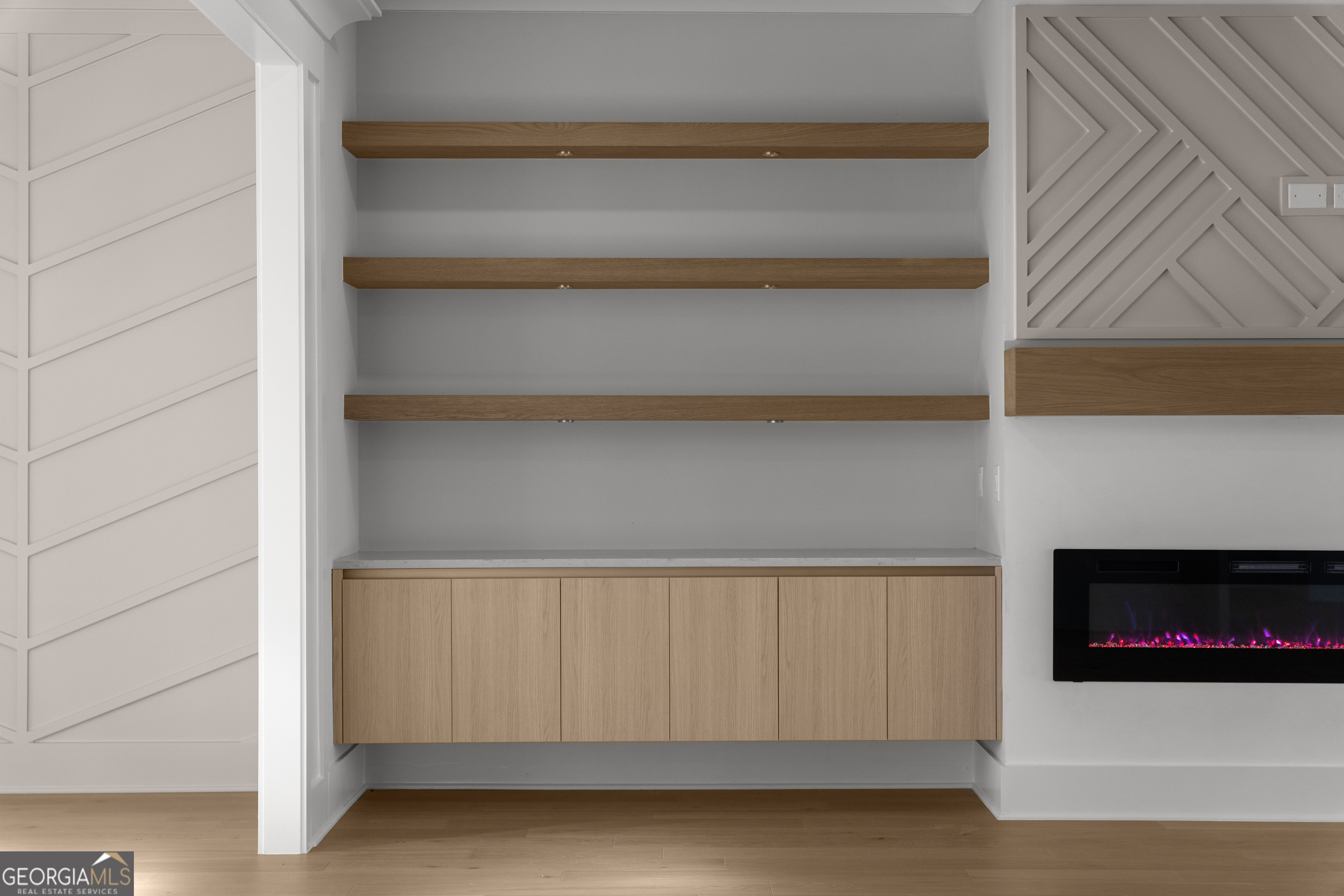 407 Thunder Road Buford, GA 30518 - Photo 27 of 133 a view of an empty room with a fireplace