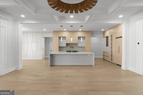 a large bathroom with double vanity sinks a toilet a glass door and a shower