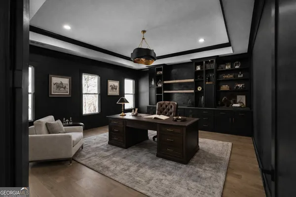 a living room with furniture and kitchen view