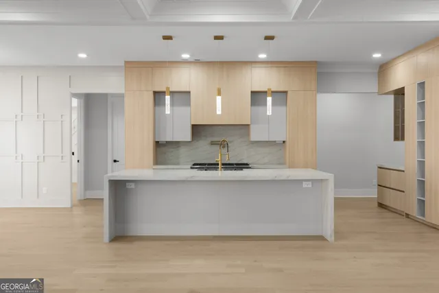 a view of light fixtures and a window in a room