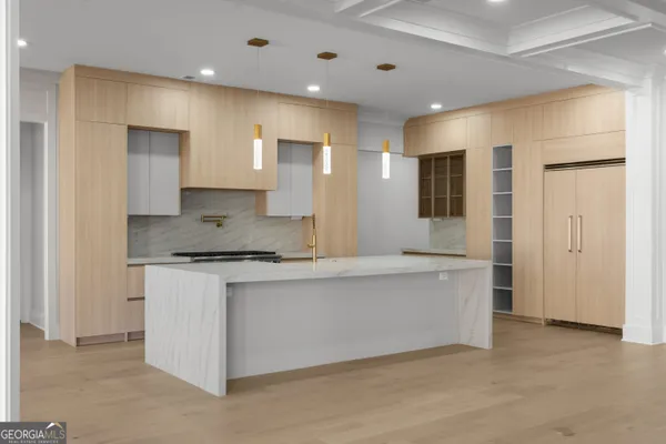 a view of light fixtures and a window in a room