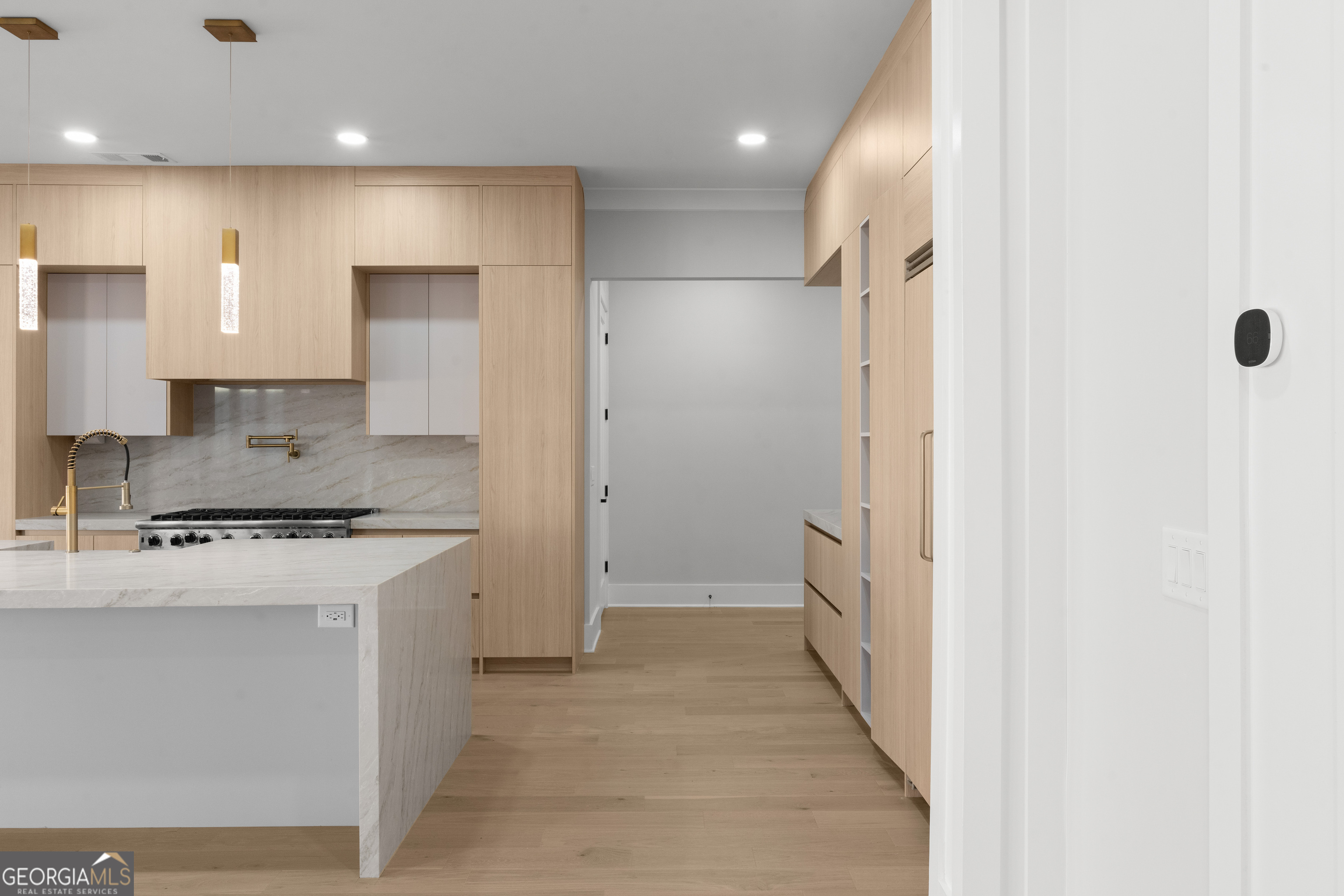 407 Thunder Road Buford, GA 30518 - Photo 35 of 133 a kitchen with a refrigerator and a stove top oven