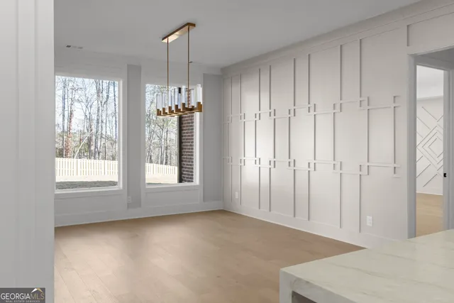 a bathroom with a granite countertop tub sink and mirror