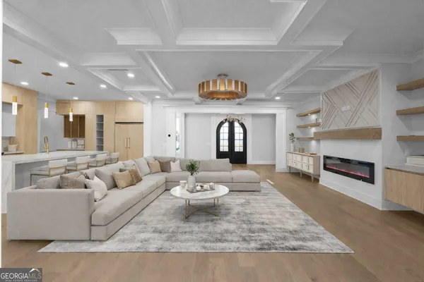 a large kitchen with a table and chairs