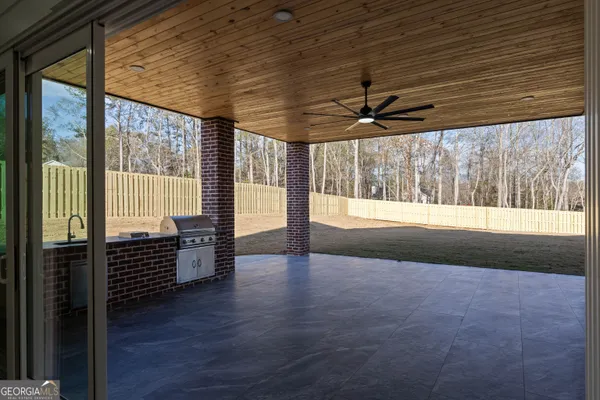 a view of outdoor space with wooden floor