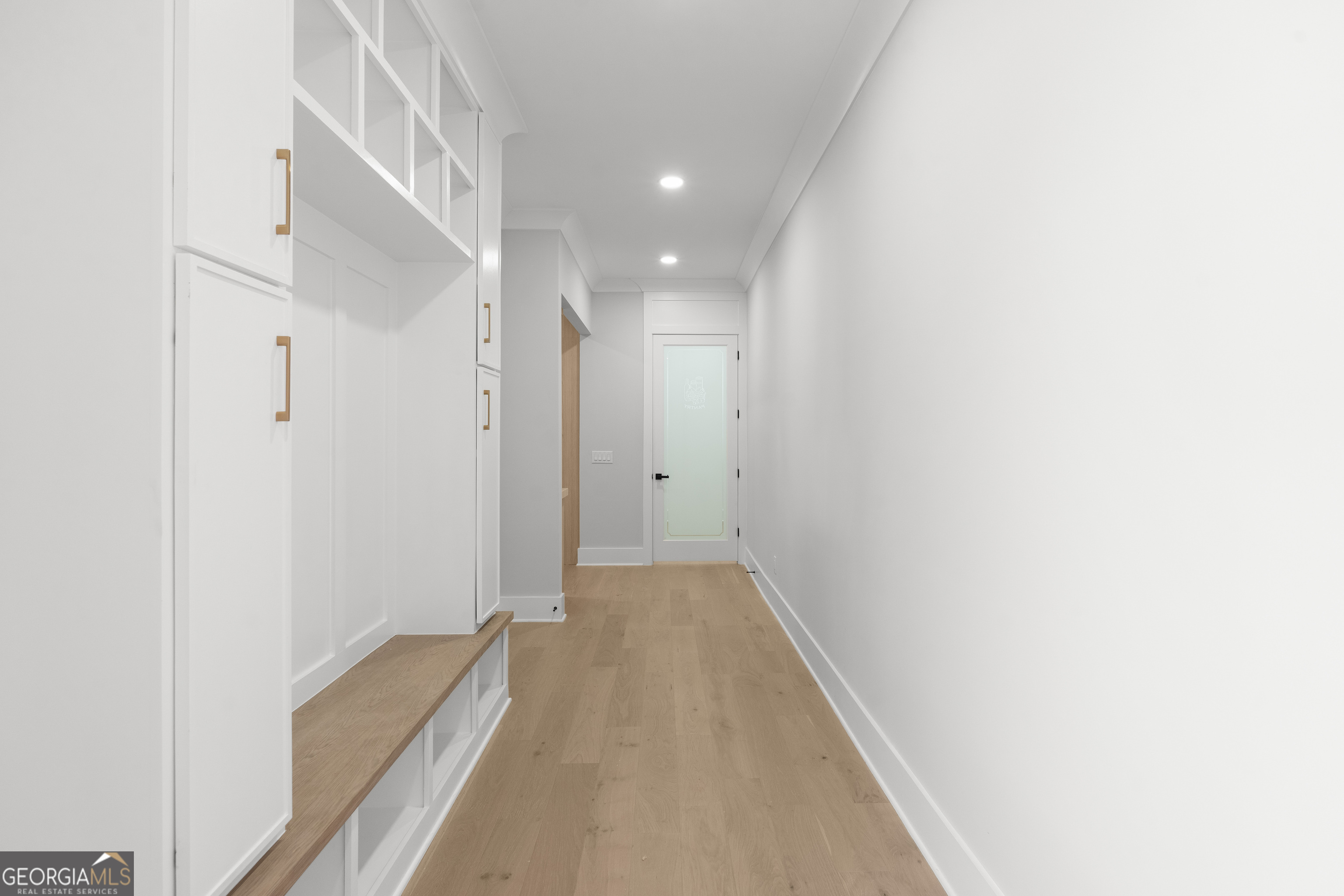 407 Thunder Road Buford, GA 30518 - Photo 47 of 133 a view of a hallway with wooden floor