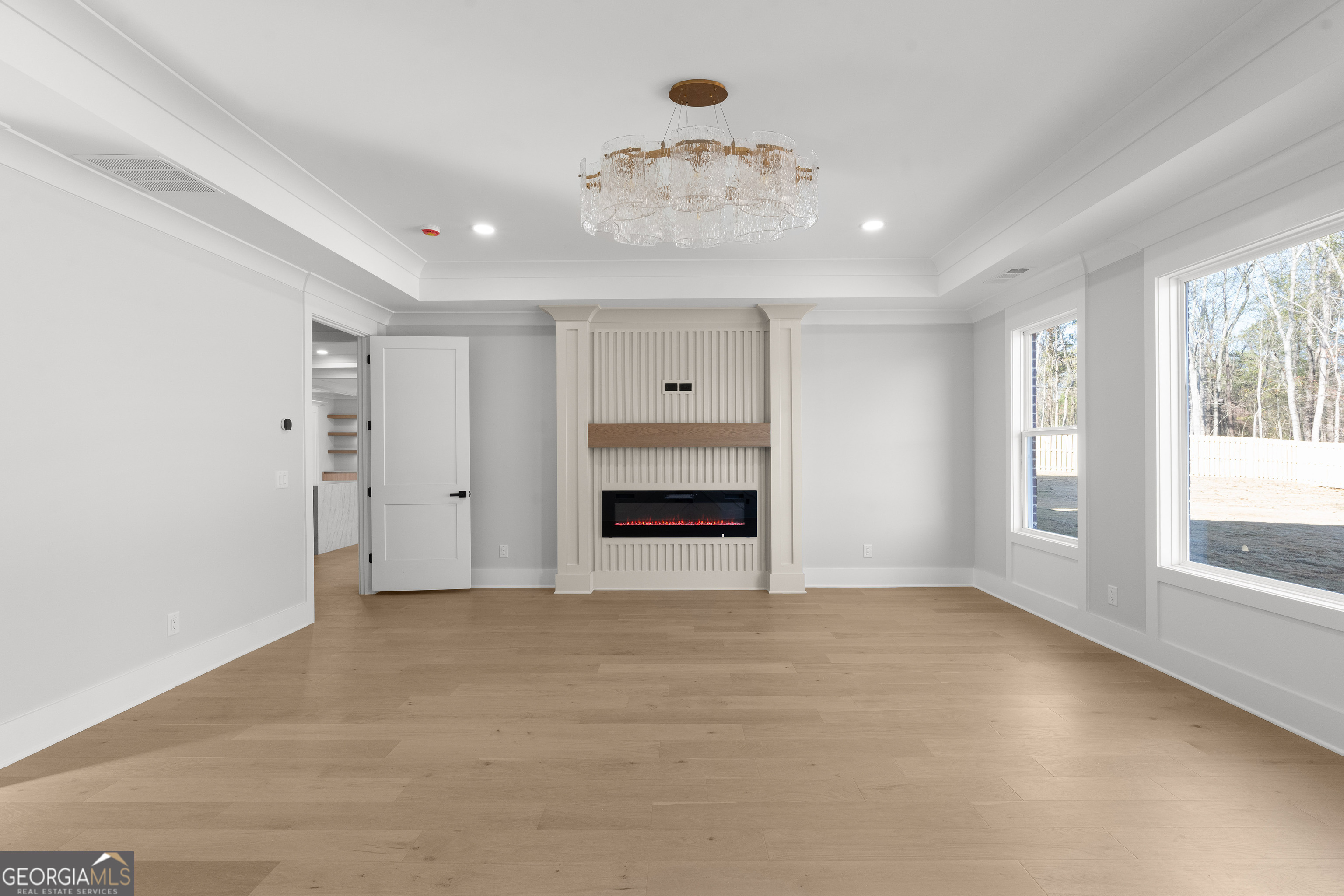 407 Thunder Road Buford, GA 30518 - Photo 59 of 133 a view of an empty room with a window