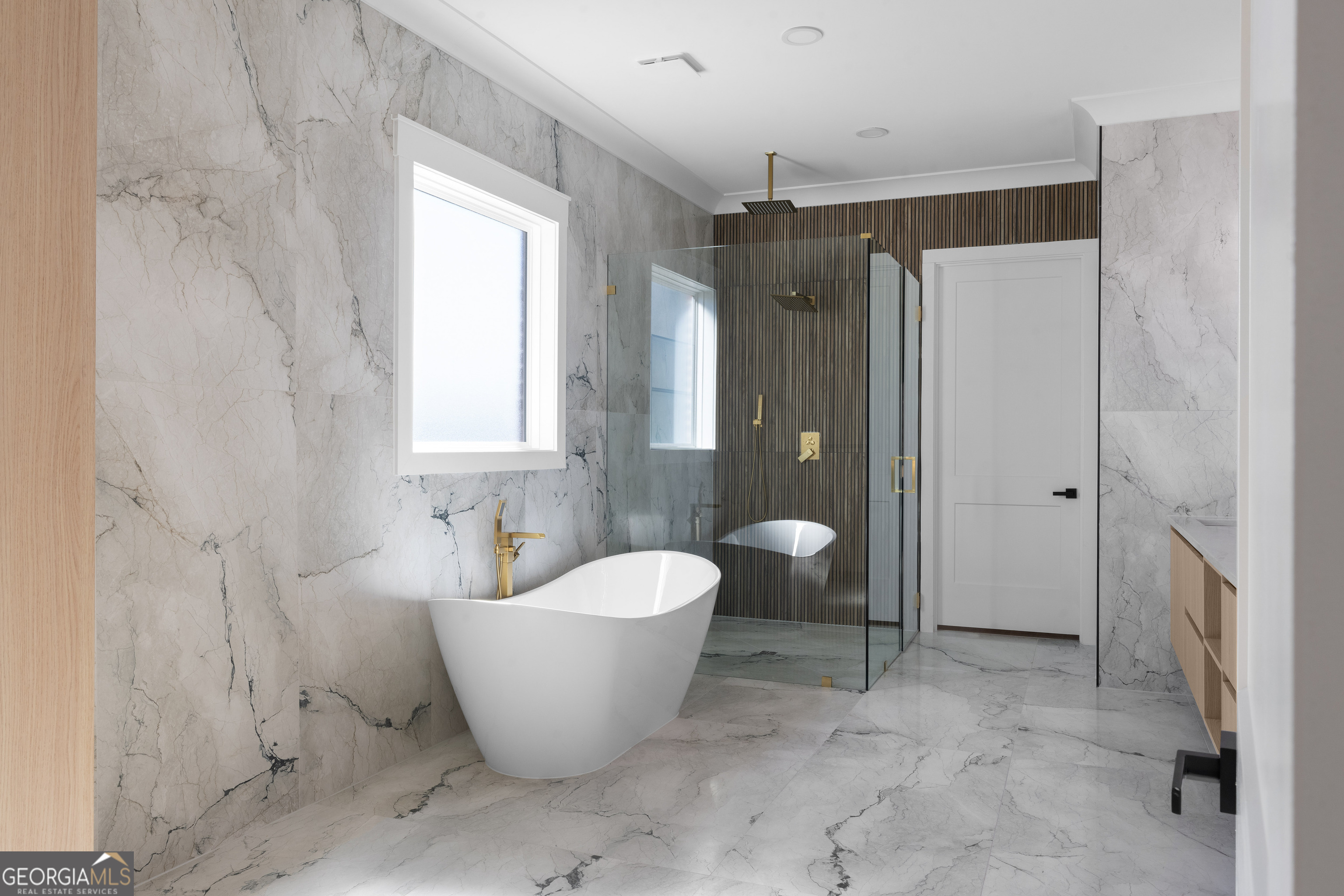 407 Thunder Road Buford, GA 30518 - Photo 62 of 133 a spacious bathroom with a bathtub and shower