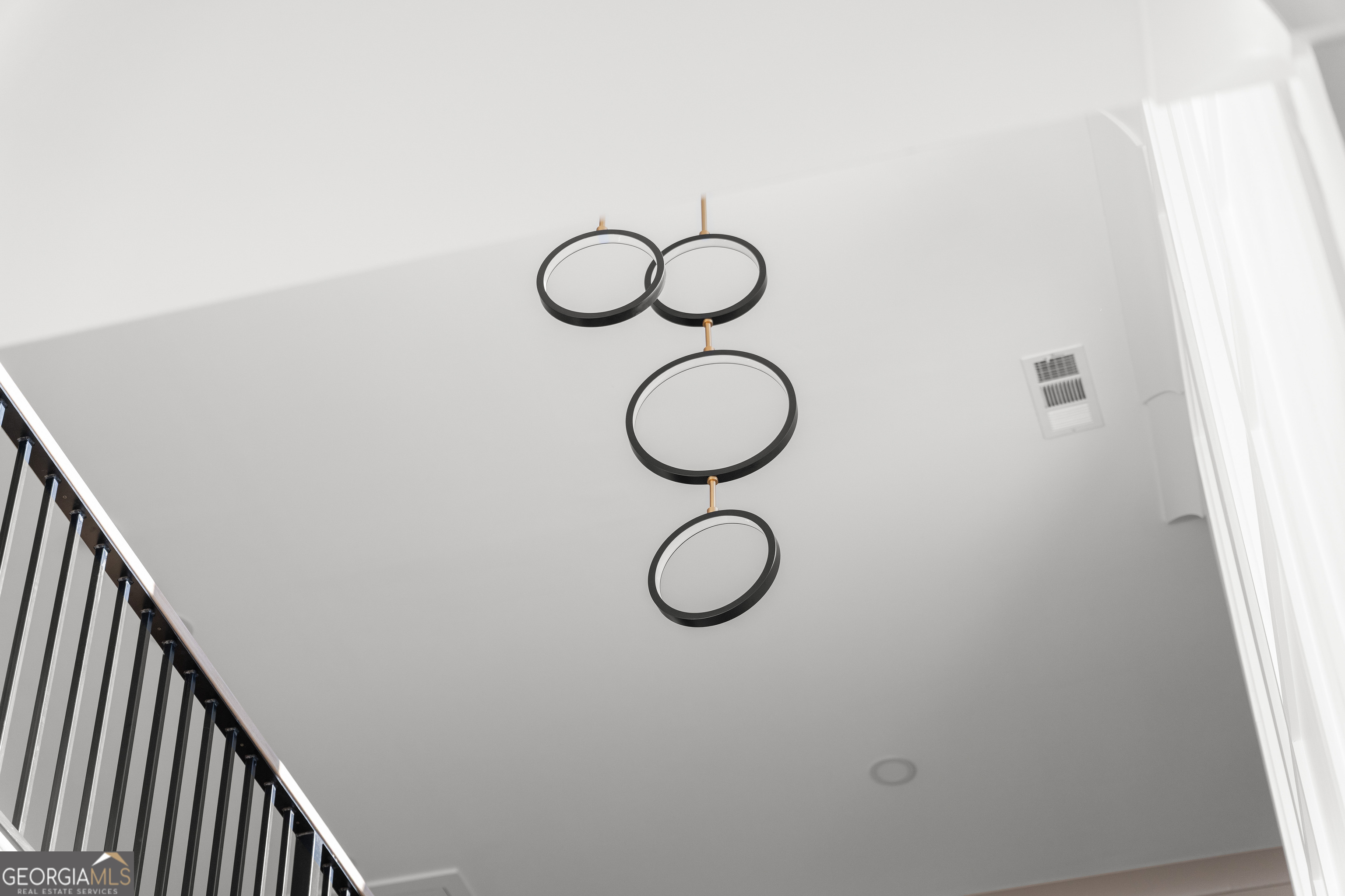 407 Thunder Road Buford, GA 30518 - Photo 77 of 133 a view of light fixtures and a window in a room