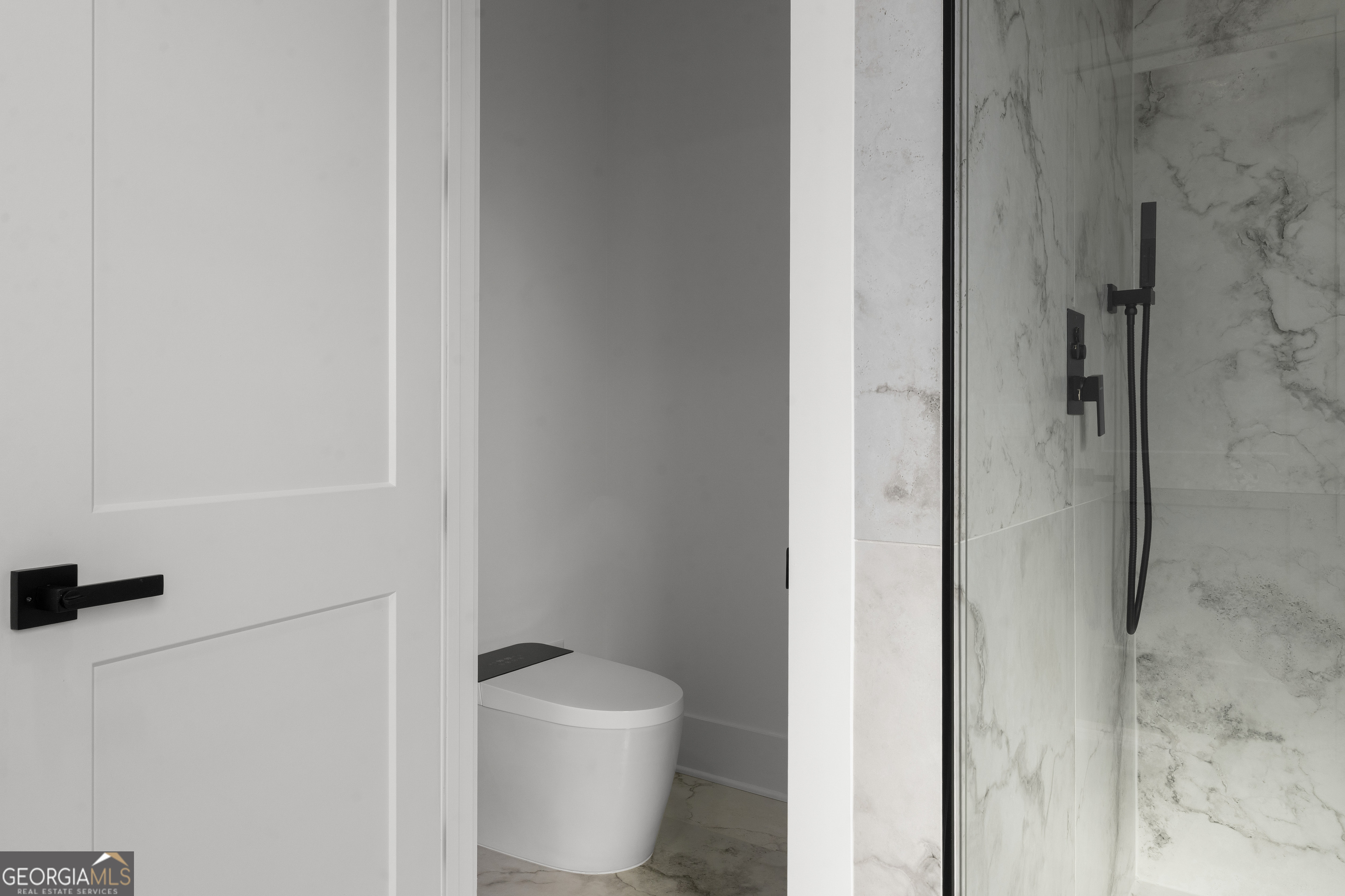 407 Thunder Road Buford, GA 30518 - Photo 86 of 133 a white toilet sitting next to a bathroom sink