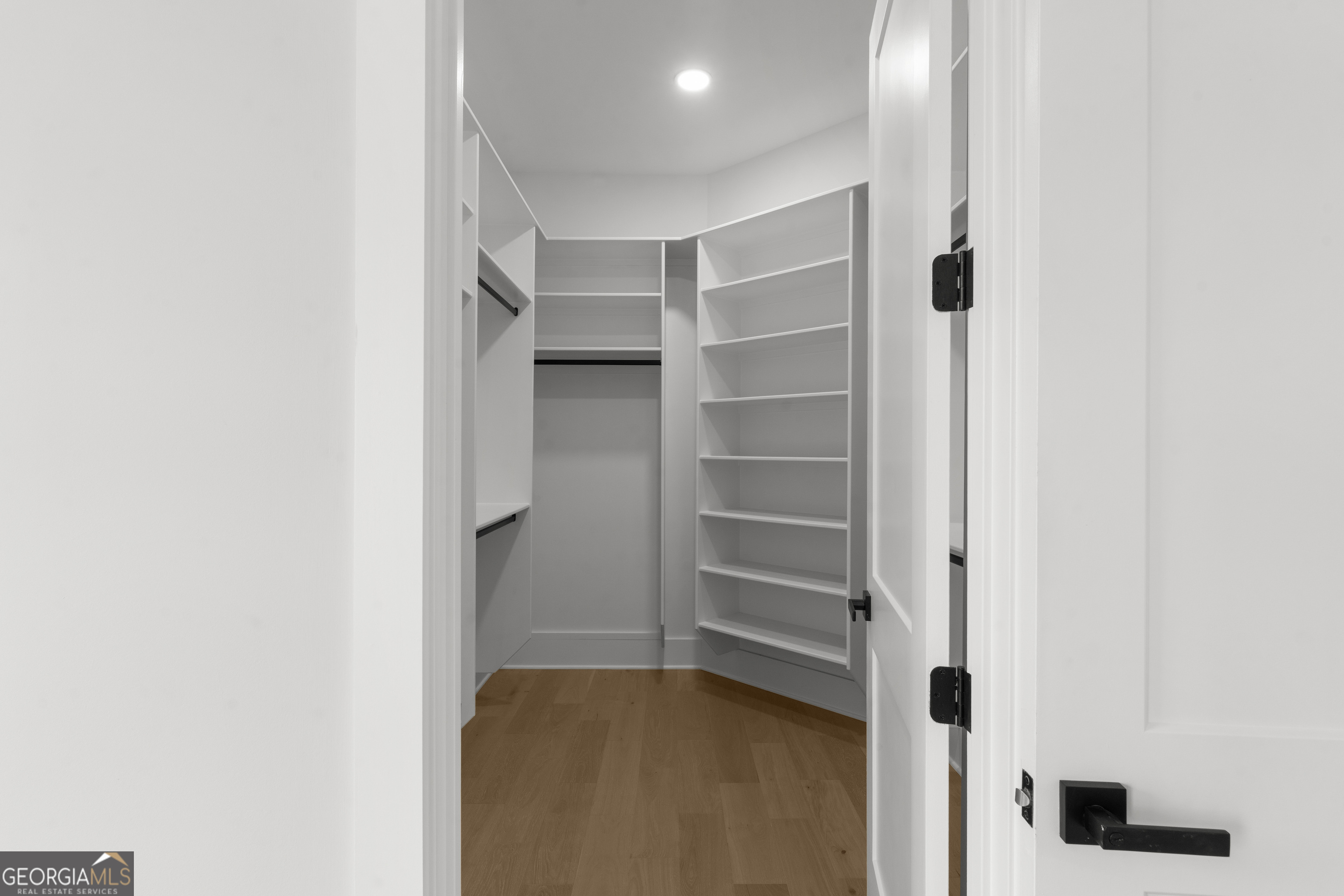 407 Thunder Road Buford, GA 30518 - Photo 93 of 133 a view of walk in closet with empty racks