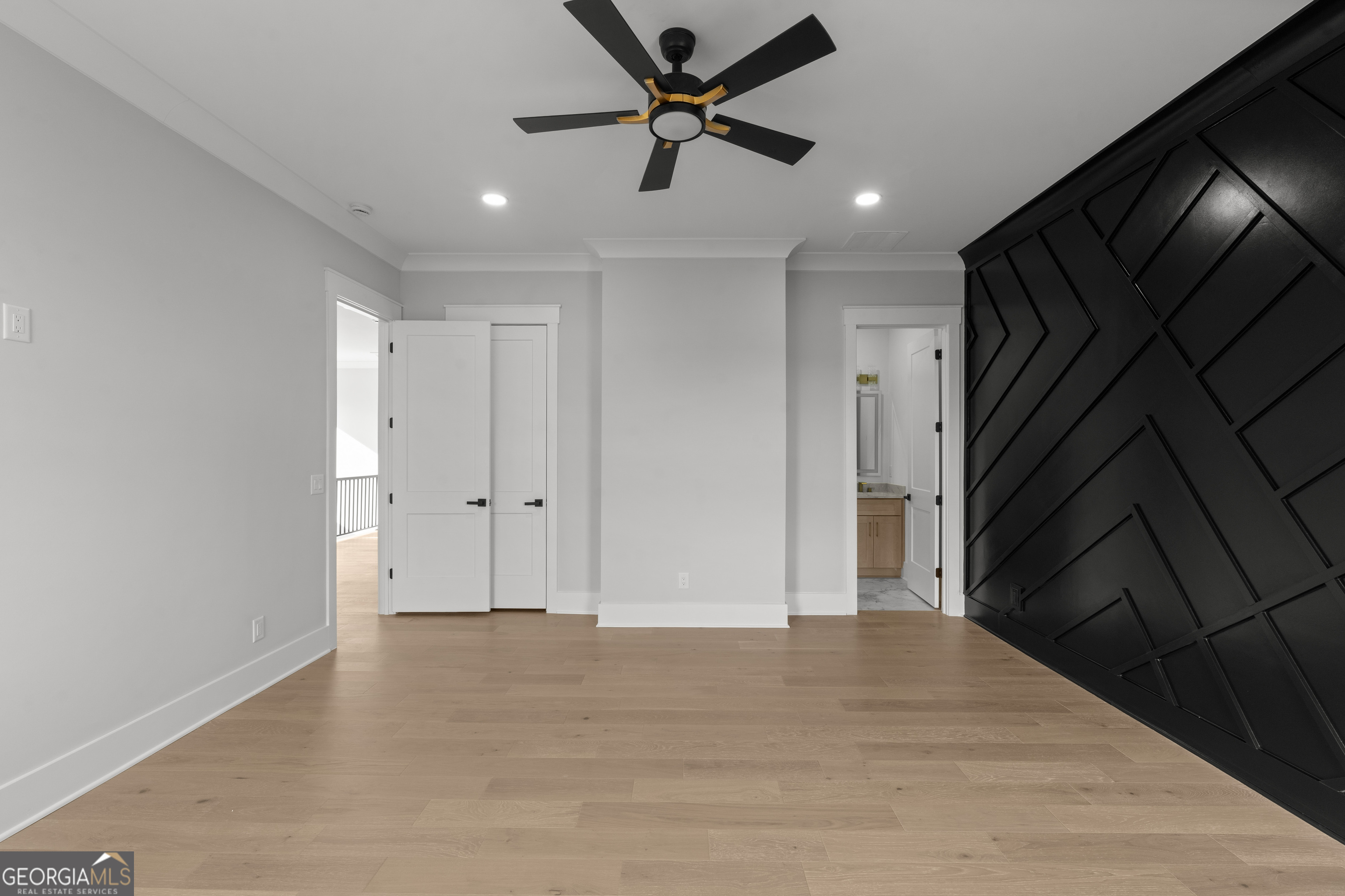 407 Thunder Road Buford, GA 30518 - Photo 96 of 133 a view of a livingroom with a ceiling fan & hardwood floor