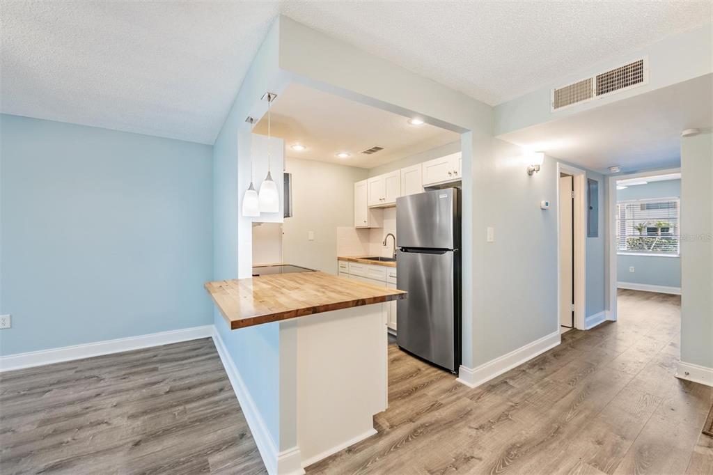 233 South McMullen Booth Road, Unit 43 Clearwater, FL 33759 - Photo 8 of 23 a kitchen with stainless steel appliances granite countertop a refrigerator and a sink
