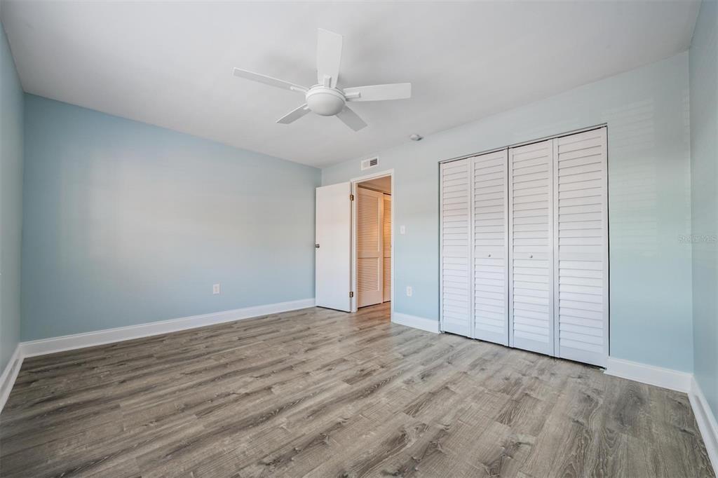 233 South McMullen Booth Road, Unit 43 Clearwater, FL 33759 - Photo 9 of 23 wooden floor in an empty room