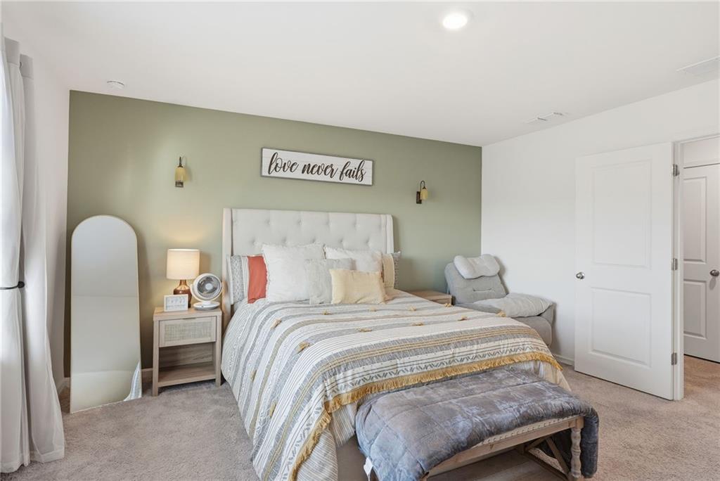 60 Thetford Way Winder, GA 30680 - Photo 15 of 34 a bedroom with a bed and a painting