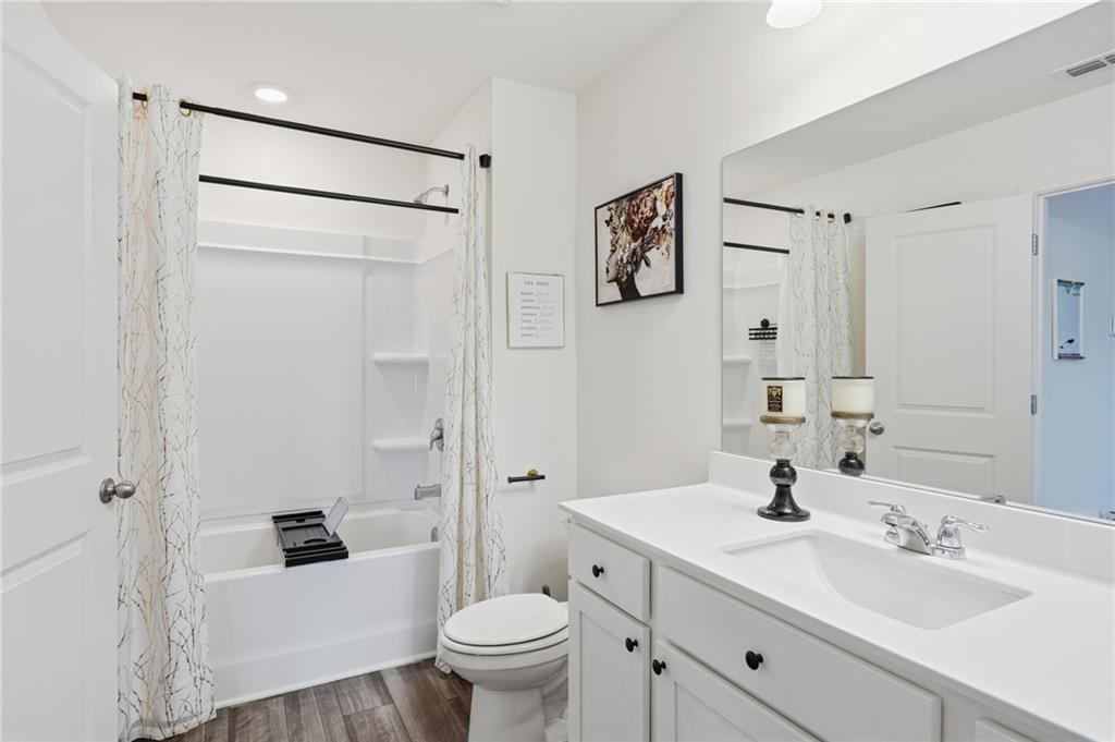 60 Thetford Way Winder, GA 30680 - Photo 17 of 34 a bathroom with a sink toilet and shower