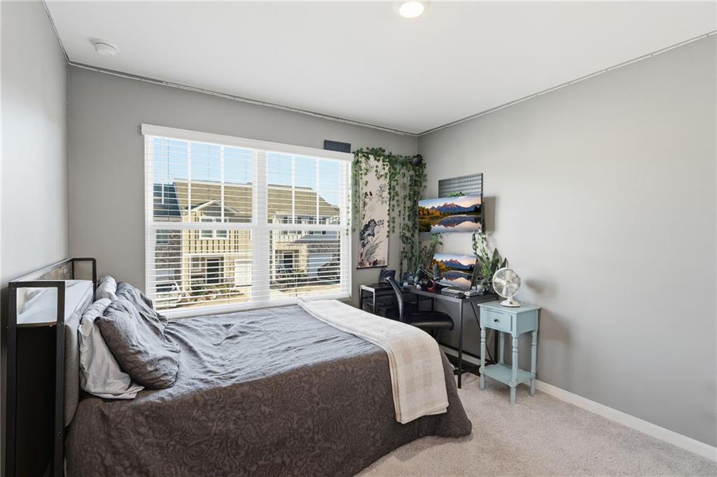 60 Thetford Way Winder, GA 30680 - Photo 20 of 34 a bedroom with a bed and a large window