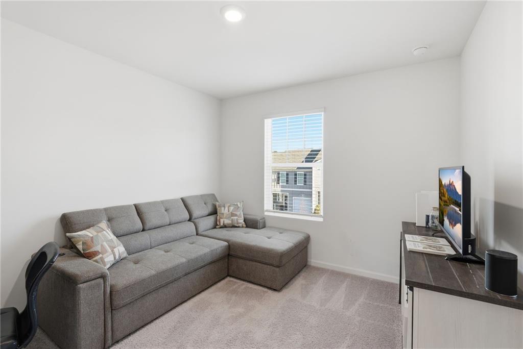 60 Thetford Way Winder, GA 30680 - Photo 22 of 34 a living room with furniture a rug and a window