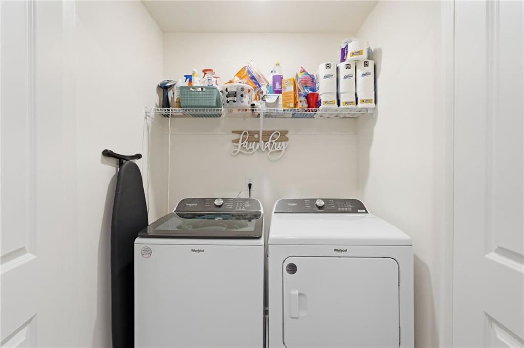 60 Thetford Way Winder, GA 30680 - Photo 23 of 34 a utility room with dryer and washer