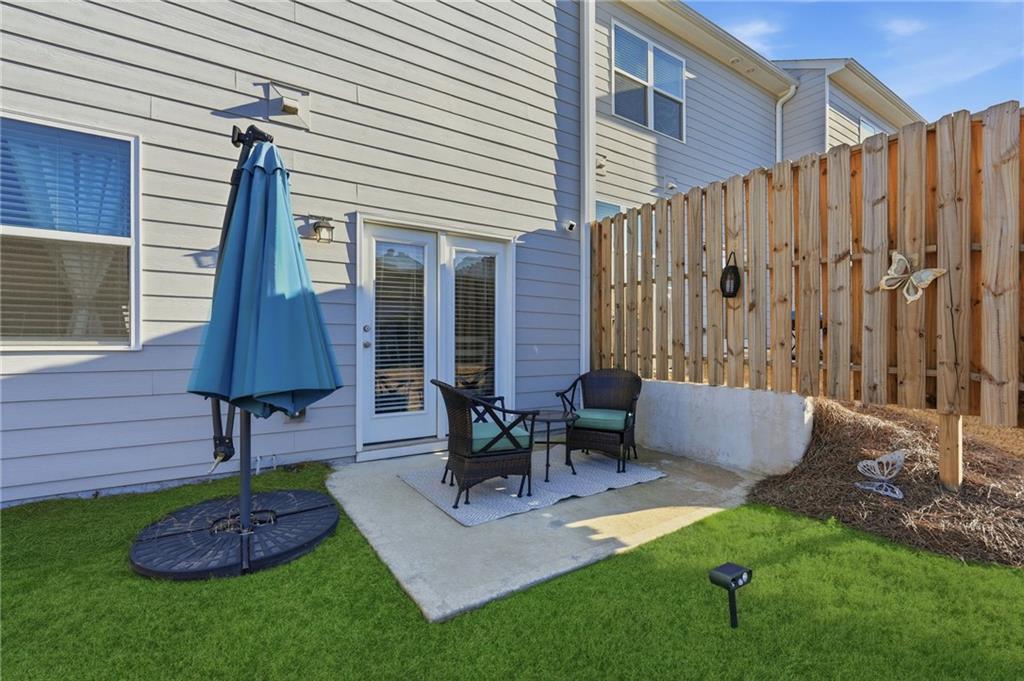 60 Thetford Way Winder, GA 30680 - Photo 24 of 34 a view of a patio with a table and chairs