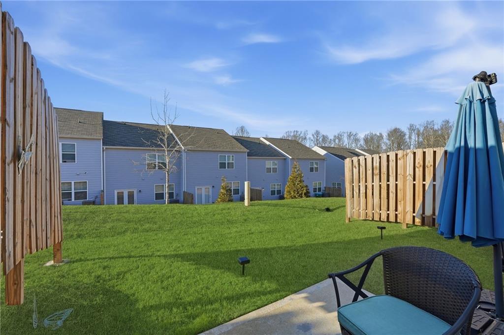 60 Thetford Way Winder, GA 30680 - Photo 25 of 34 a front view of a house with garden