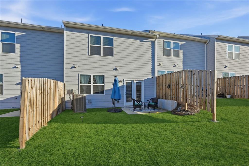 60 Thetford Way Winder, GA 30680 - Photo 27 of 34 a front view of house with a garden and patio