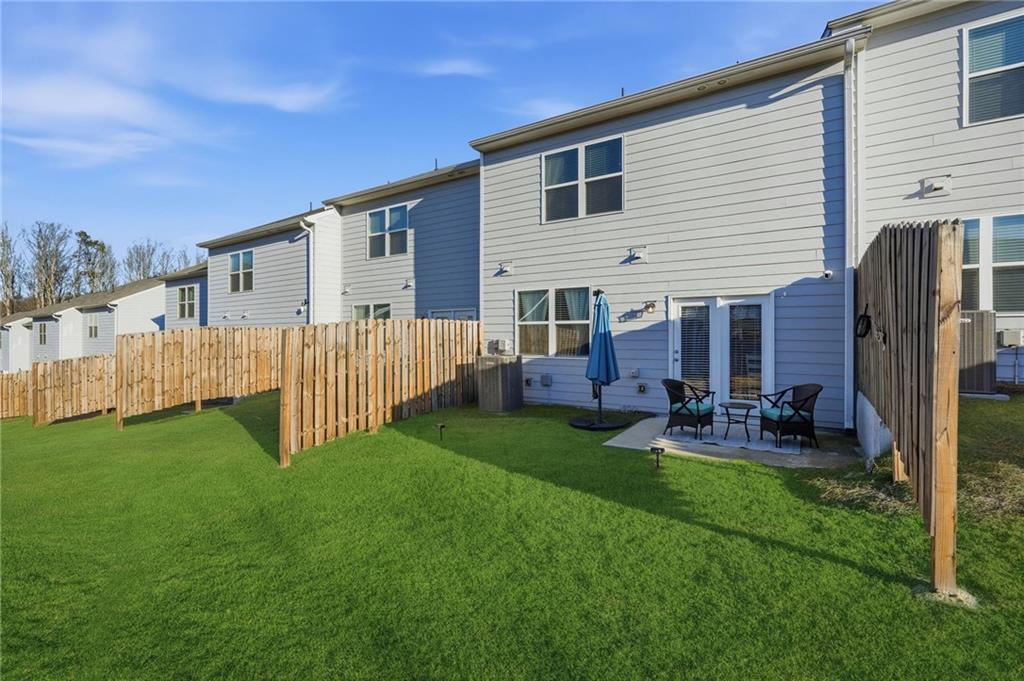 60 Thetford Way Winder, GA 30680 - Photo 28 of 34 a view of backyard of house with wooden deck and furniture
