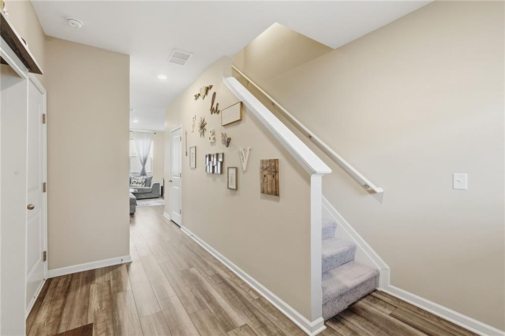 60 Thetford Way Winder, GA 30680 - Photo 3 of 34 a view of entryway and hall with wooden floor
