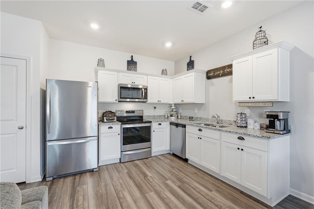 60 Thetford Way Winder, GA 30680 - Photo 5 of 34 a kitchen with stainless steel appliances a refrigerator sink and microwave