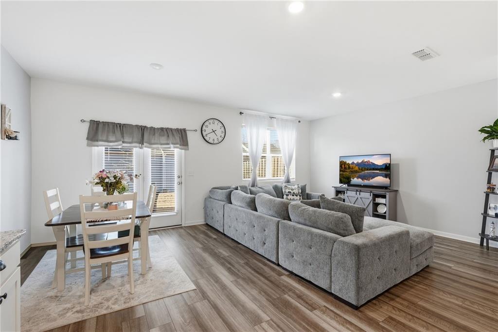 60 Thetford Way Winder, GA 30680 - Photo 8 of 34 a living room with furniture and a flat screen tv