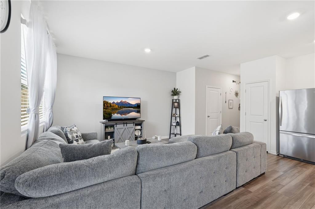 60 Thetford Way Winder, GA 30680 - Photo 10 of 34 a living room with furniture and a flat screen tv