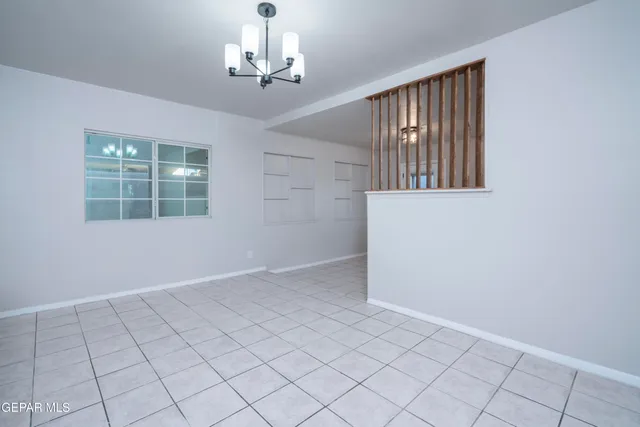 a view of an empty room with windows