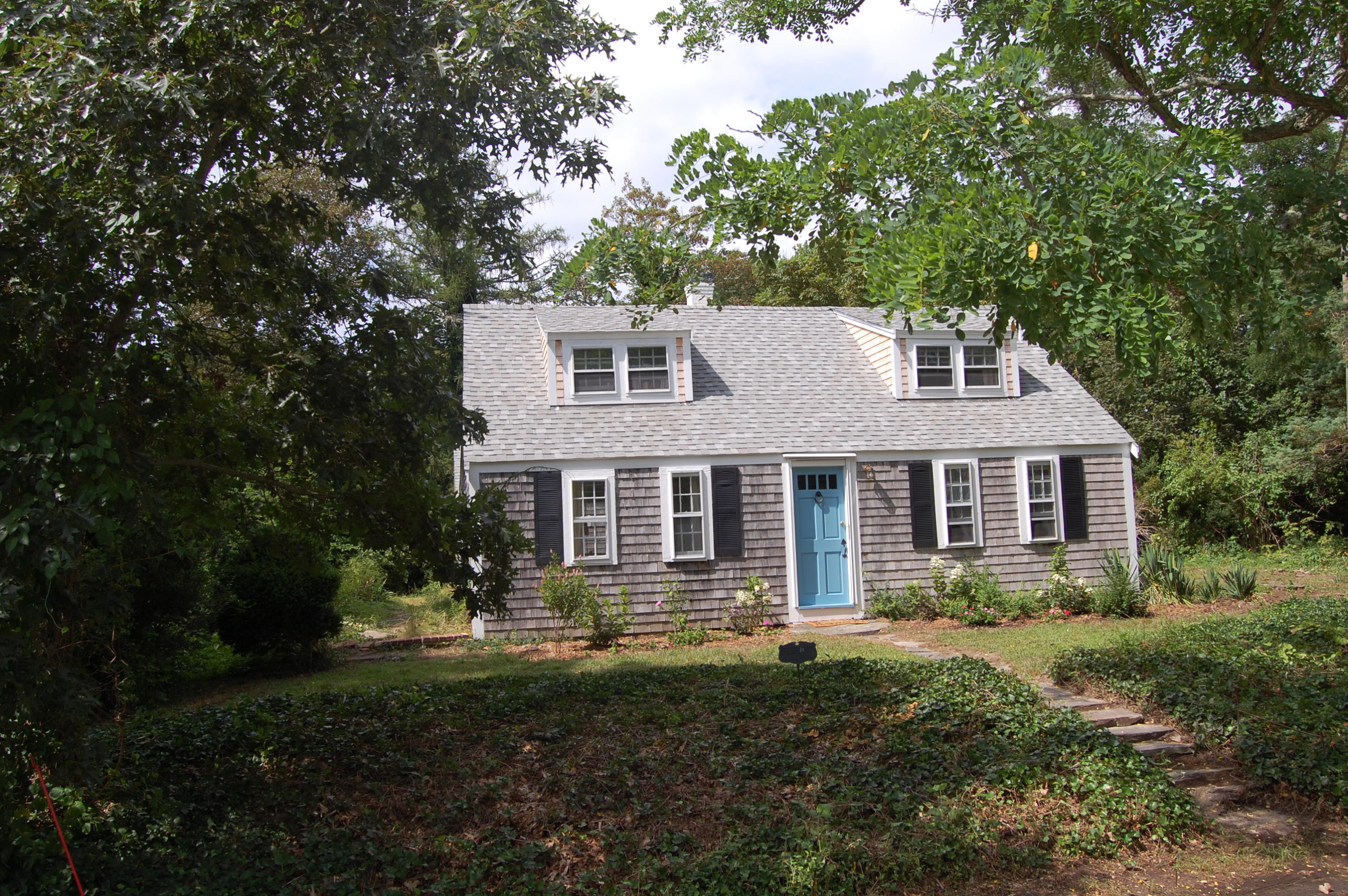 46 Namskaket Road Orleans, MA 02653 - Photo 11 of 35 a front view of a house with a yard