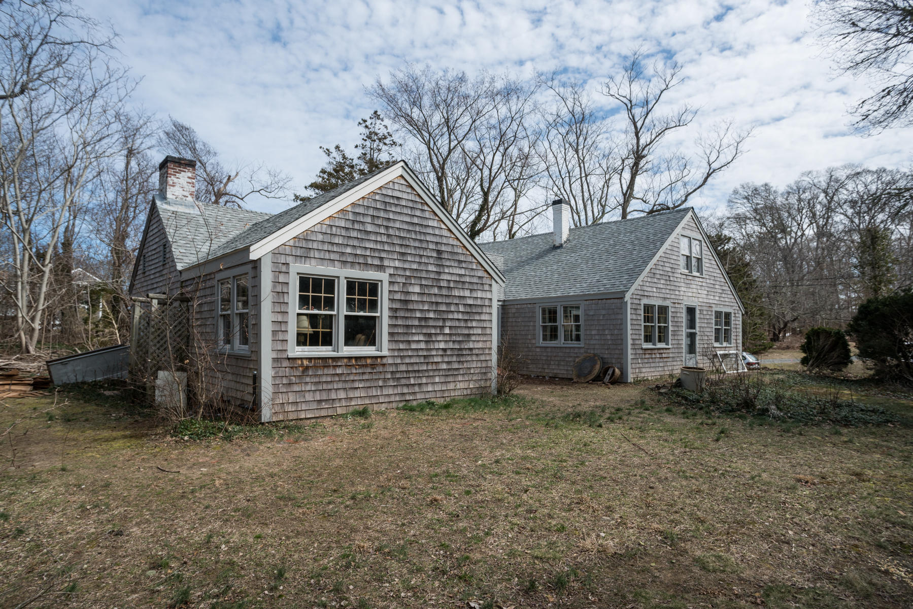 46 Namskaket Road Orleans, MA 02653 - Photo 12 of 35 a front view of a house with a yard