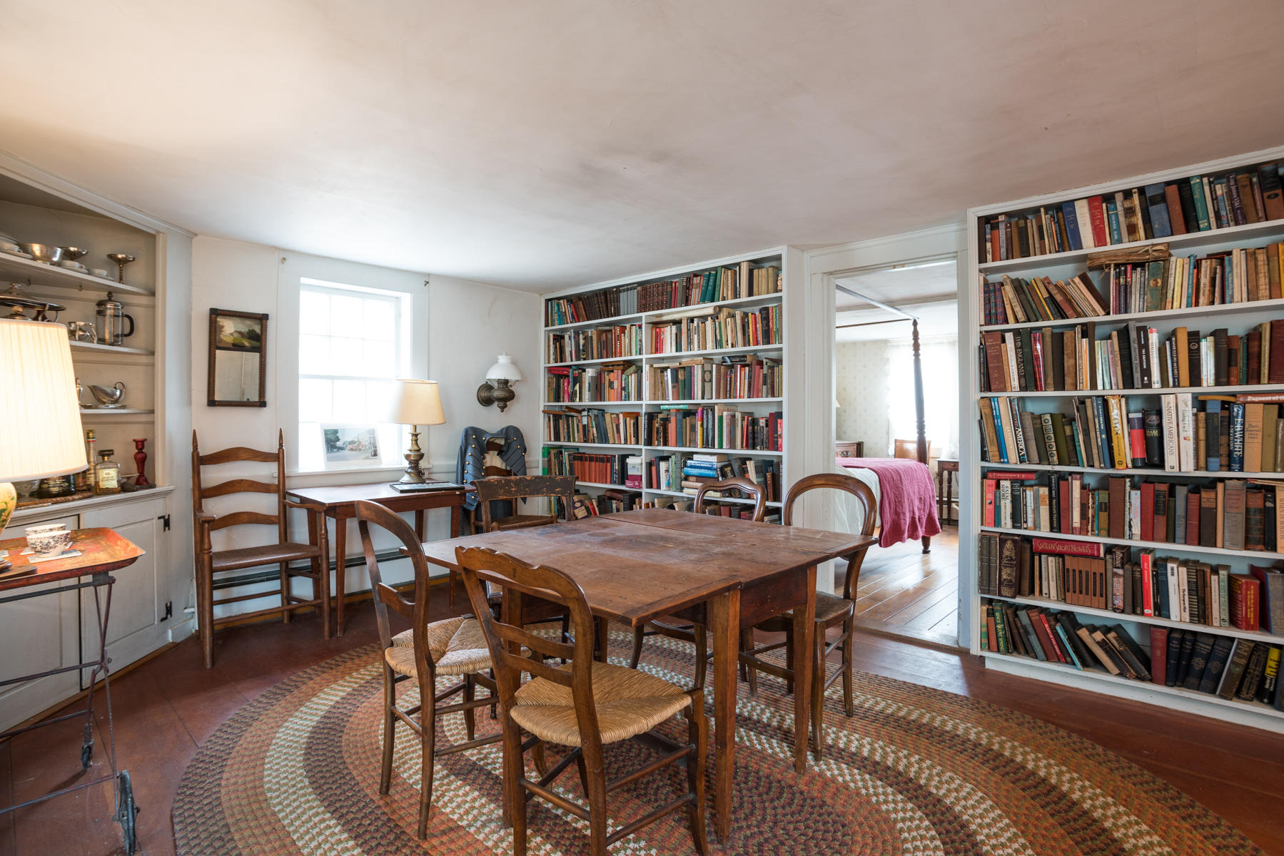 46 Namskaket Road Orleans, MA 02653 - Photo 18 of 35 a view of a livingroom with furniture and a bookshelf