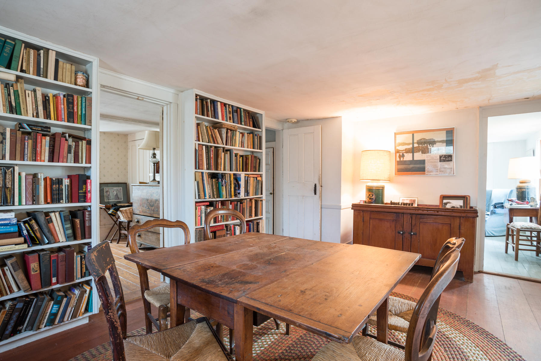 46 Namskaket Road Orleans, MA 02653 - Photo 20 of 35 a view of a workspace with furniture and a bookshelf