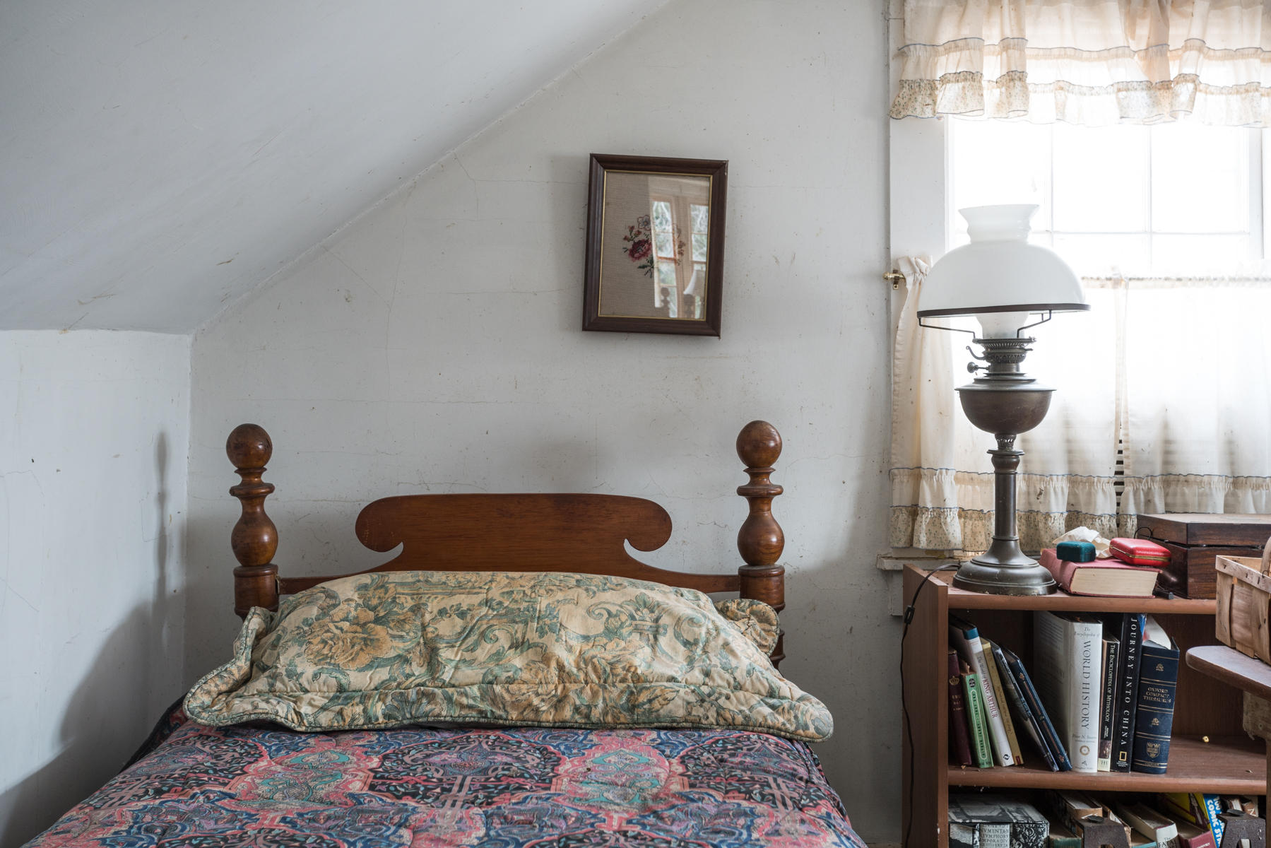 46 Namskaket Road Orleans, MA 02653 - Photo 30 of 35 a bedroom with a bed and lamp on the dresser